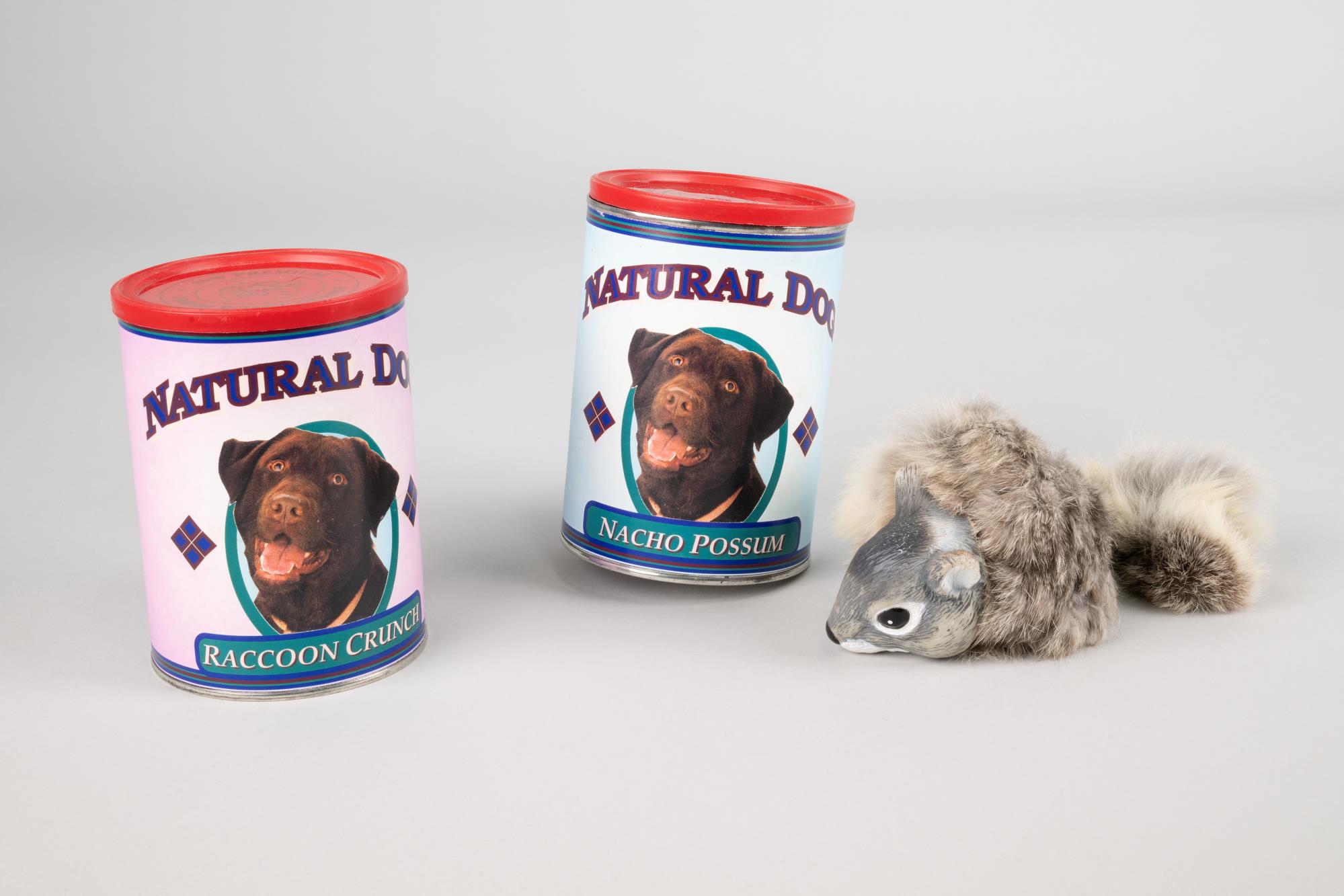Image of Props from Almost Live! Fake dog food cans and squirrel from 